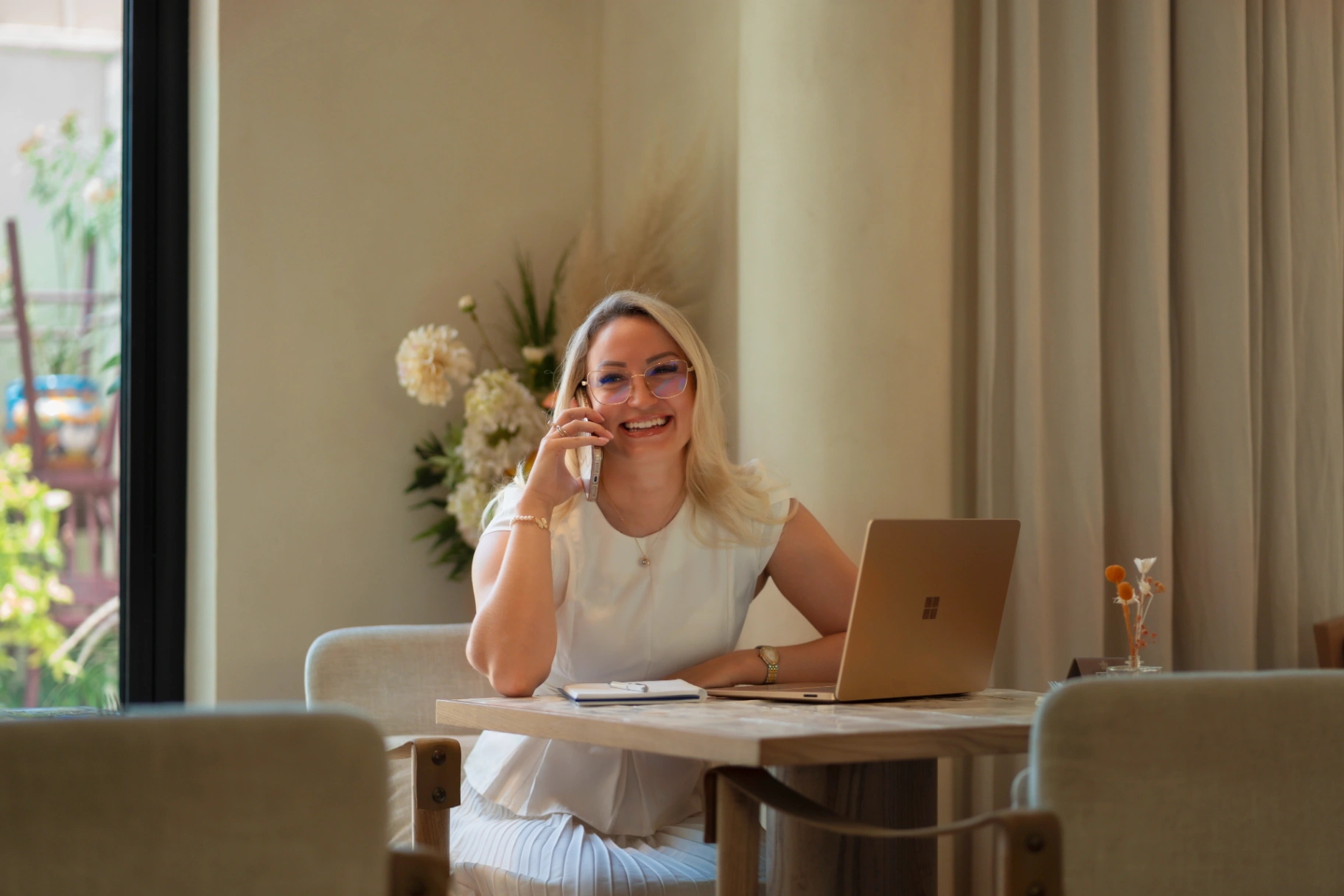 Adri Daniel reading and writing her hormone health guides