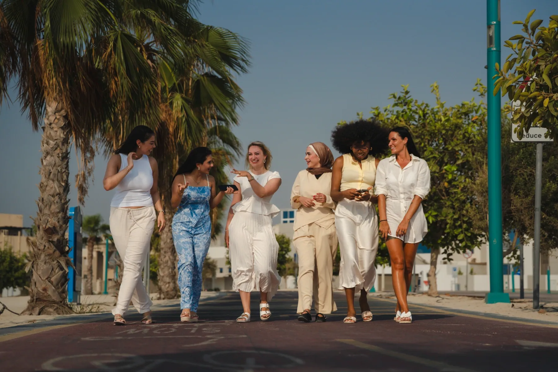 A group of women walking together outdoors, part of the Hormone Method community