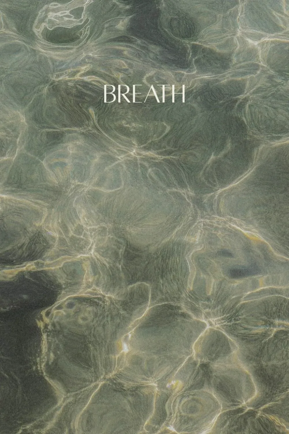 Sunlight moving across clear shallow water